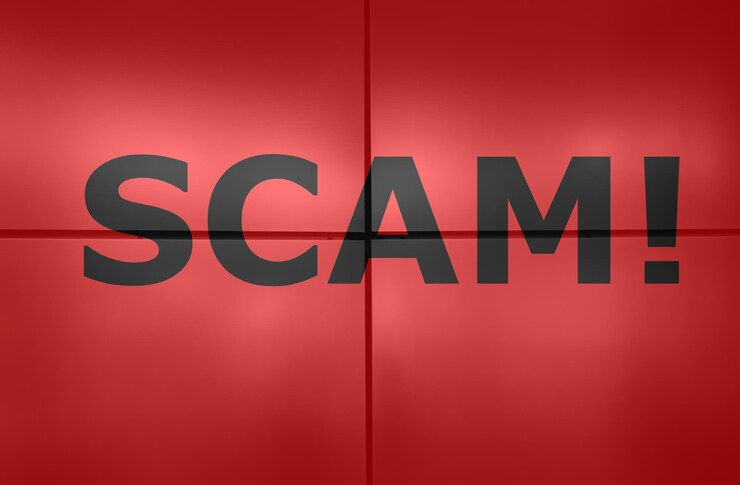 Red flag with the word "Scam" symbolizing online fraud alerts for online payment security.